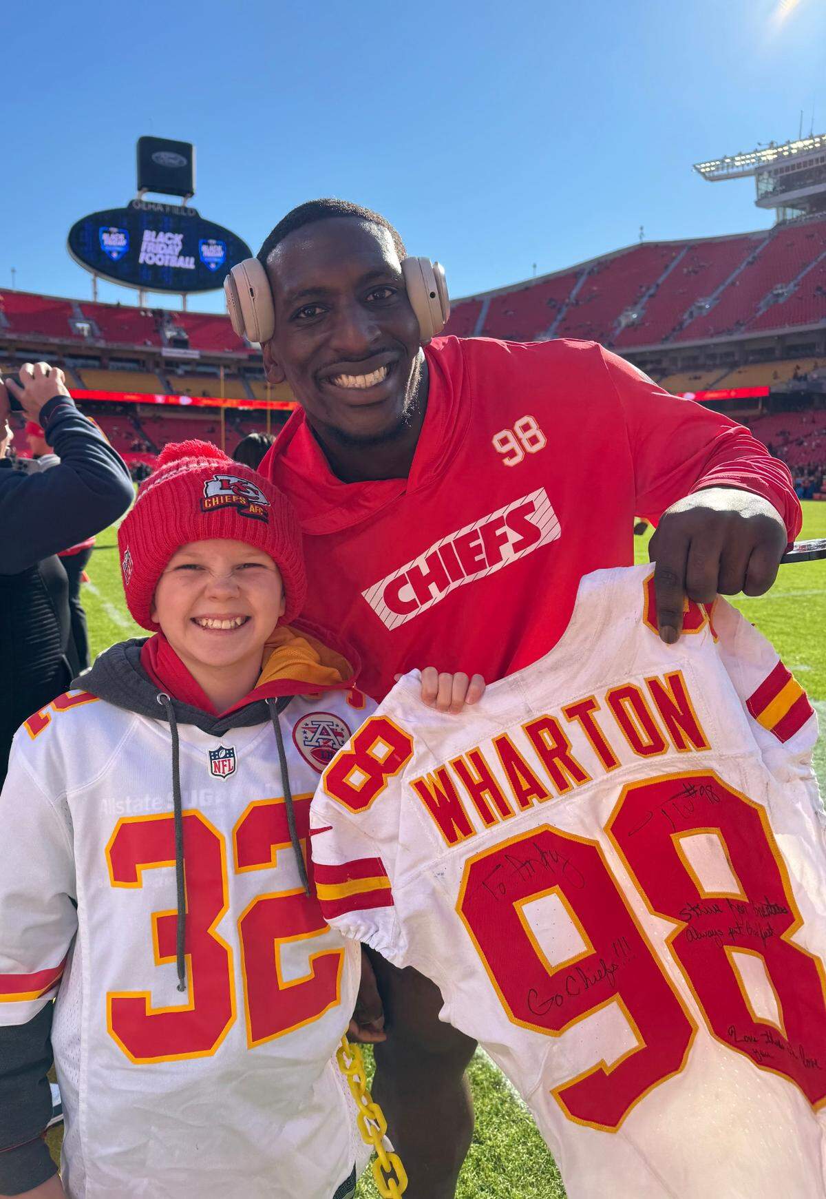 The Chiefs’ Tershawn Wharton with fan Andy Radzavicz before KC’s 2024 Black Friday game at GEHA Field at Arrowhead Stadium.