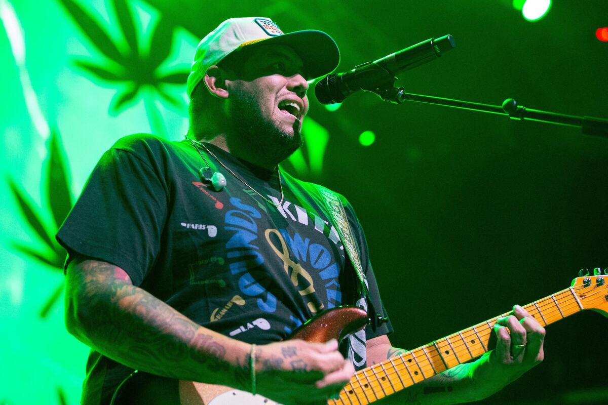 Rome Ramirez plays the guitar and sings while performING with Sublime with Rome at Kansas City Power & Light on Saturday.