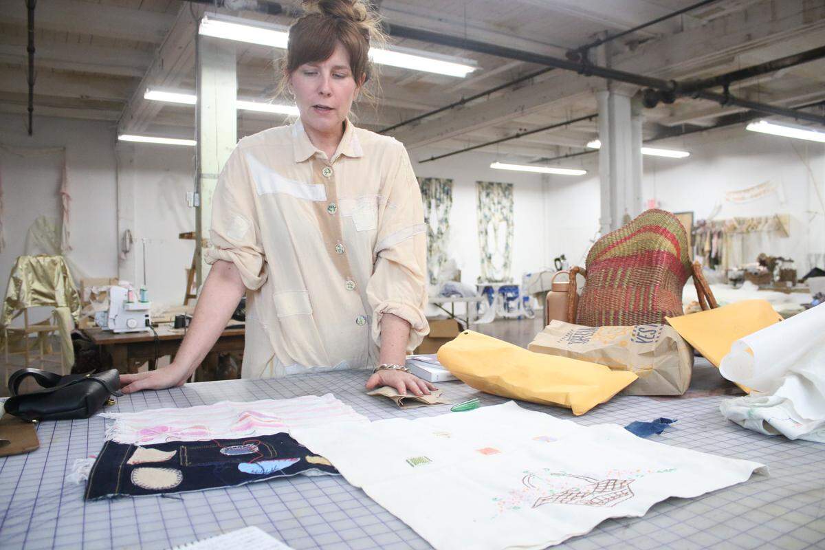Artist Hadley Clark shows some of the stitching techniques she teaches a variety of classes and workshops, including one coming up on Sept. 25 at the Nerman Museum of Contemporary Art.