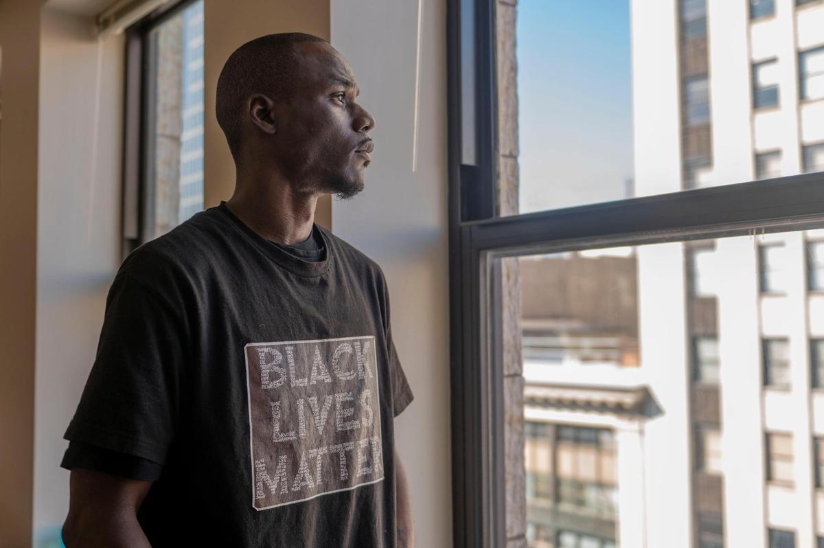 Justin Layton speaks about his experience with the Independence police department at his home in Kansas City on Tuesday, March 15, 2022. Layton claims the police violated his civil rights when they arrested him for “jaywalking” just over two years ago.