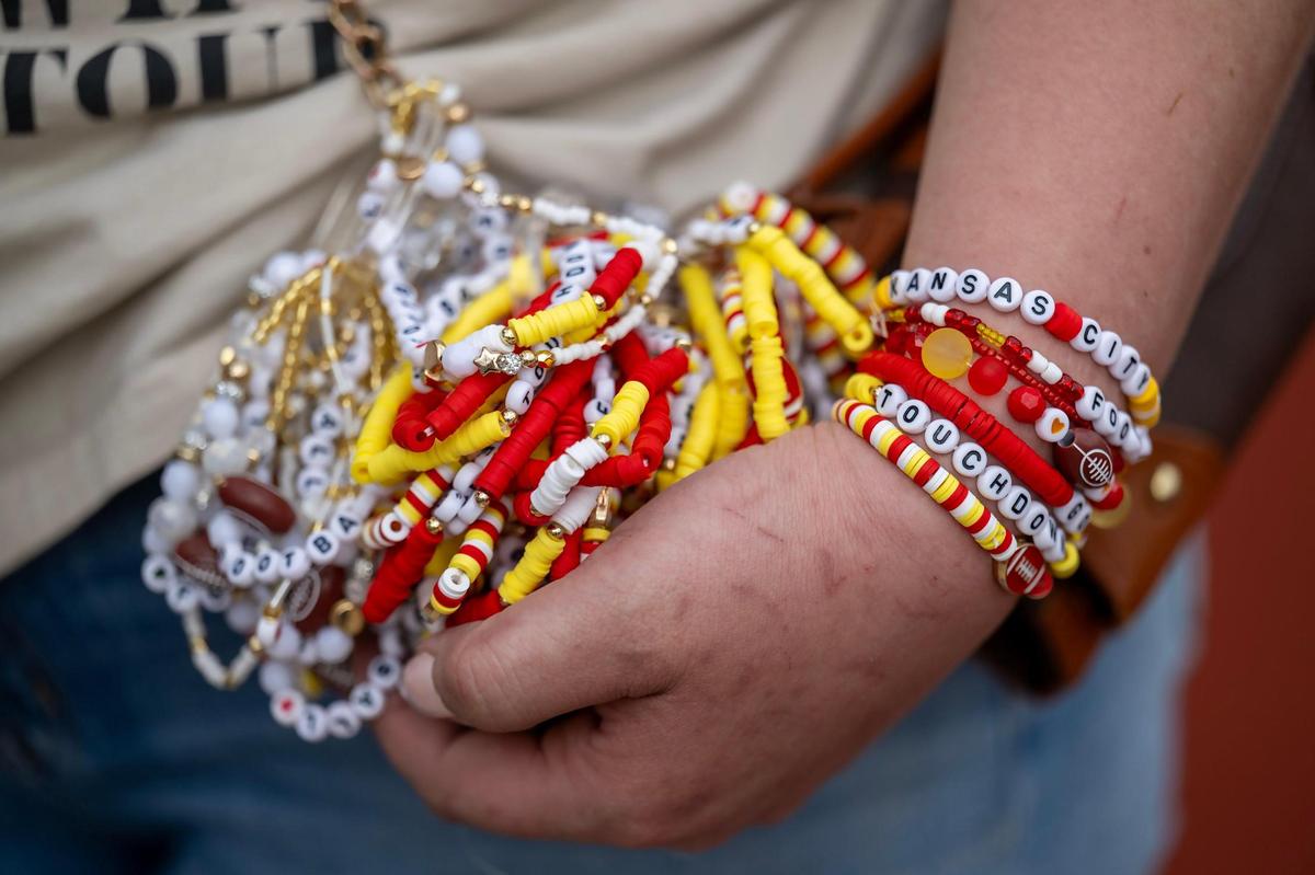 Stephanie Easley, holds some of the friendship bracelets made by her and her daughter, Elena Easley, 8, that will be given out by Elena at the home opener of the Kansas City Glory, the city’s semi-professional women’s full-contact tackle football team, during their home opener on Saturday, March 29, 2025, at the Pembroke Hill School in Kansas City.