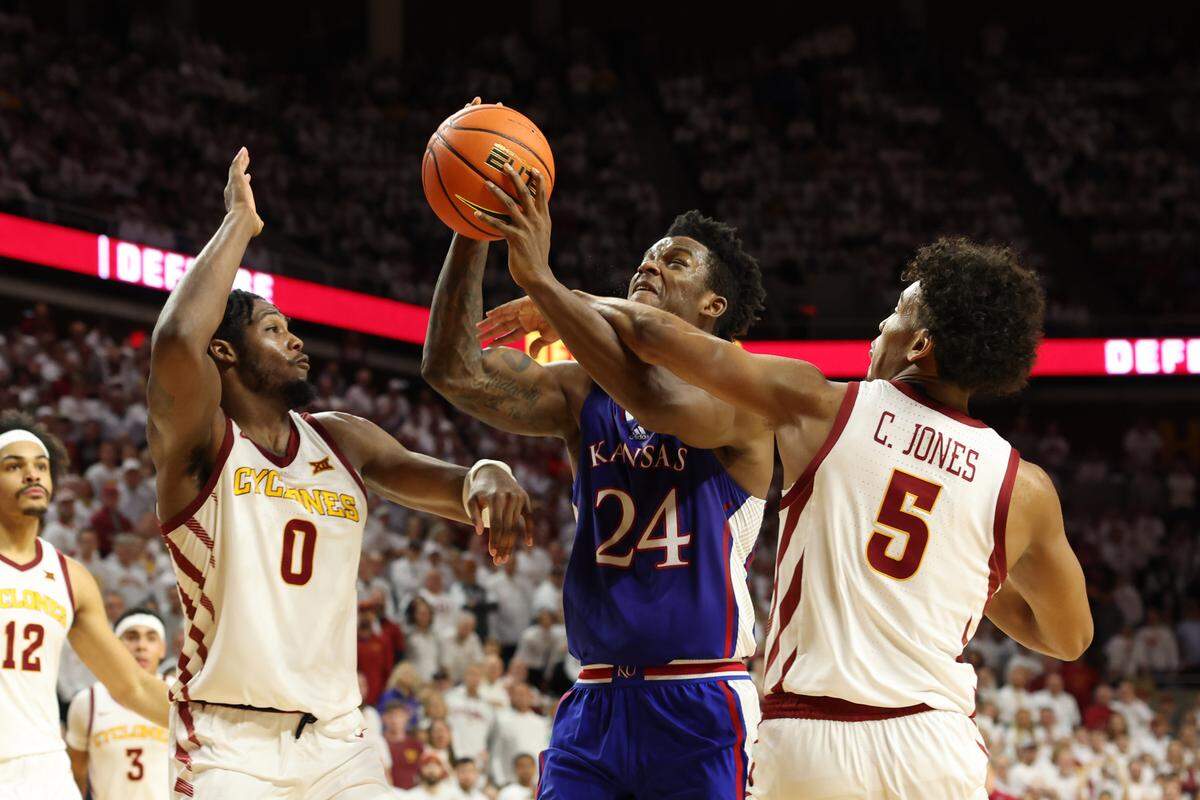 Kansas Jayhawks forward K.J. Adams (24) is fouled by Iowa State Cyclones guard Curtis Jones (5) at James H. Hilton Coliseum on Feb. 4, 2023.