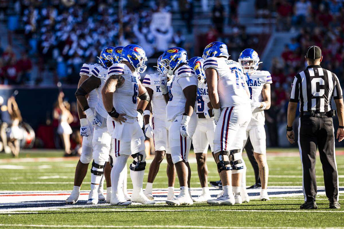 The Kansas Jayhawks huddle during a road game against the Arizona Wildcats on Nov. 8, 2025.