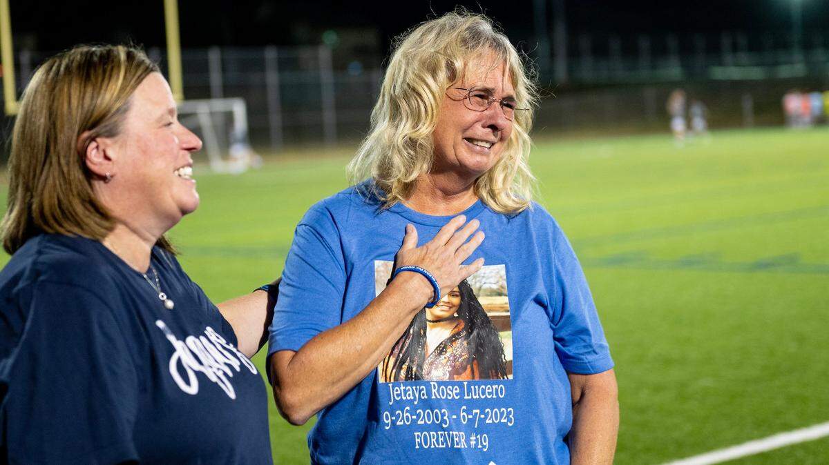 Sharen Lucero, right, the mother of Jetaya Lucero, reacts after speaking about her daughter at a soccer game in Shawnee. Jetaya died from fentanyl in June.