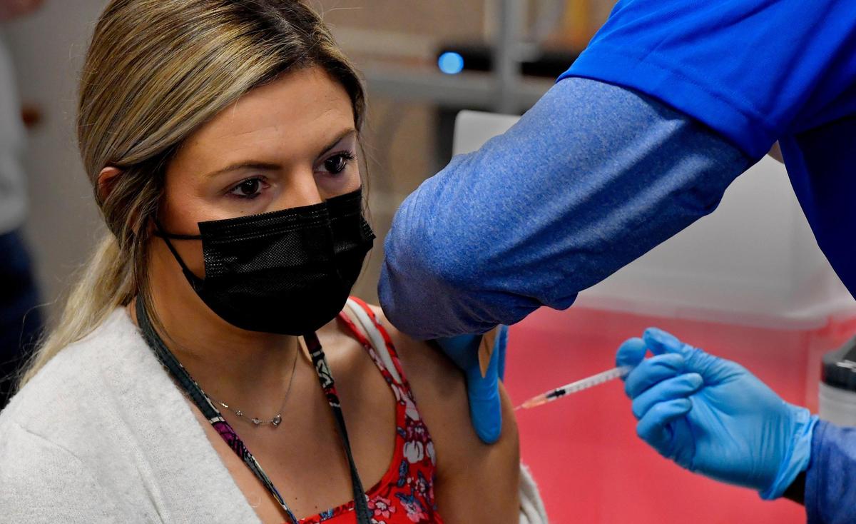 On March 22, Kansas residents 16 to 64 with certain medical conditions will be eligible for the COVID vaccine, no proof needed in some counties. Here Desirea Fraust, a speech and language teacher at Longfellow and Faxon schools, received a dose at Kansas City’s Manual Career Technical Center.