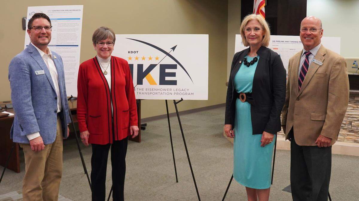 Gov. Laura Kelly, center left, with Kansas Secretary of Transportation Julie Lorenz, center right.