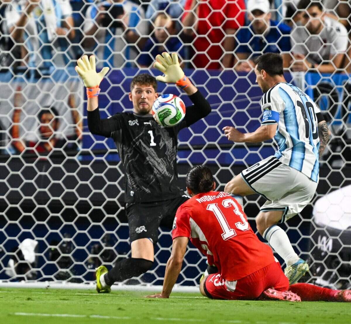 Switzerland goalkeeper Gregor Kobel (1) makes a save against Argentina forward Lionel Messi (10)'s attempt on goal in the Argentina vs. Switzerland 2026 World Cup Quarterfinal football match at Kansas City (Arrowhead) Stadium in Kansas City on Saturday, July 11, 2026.