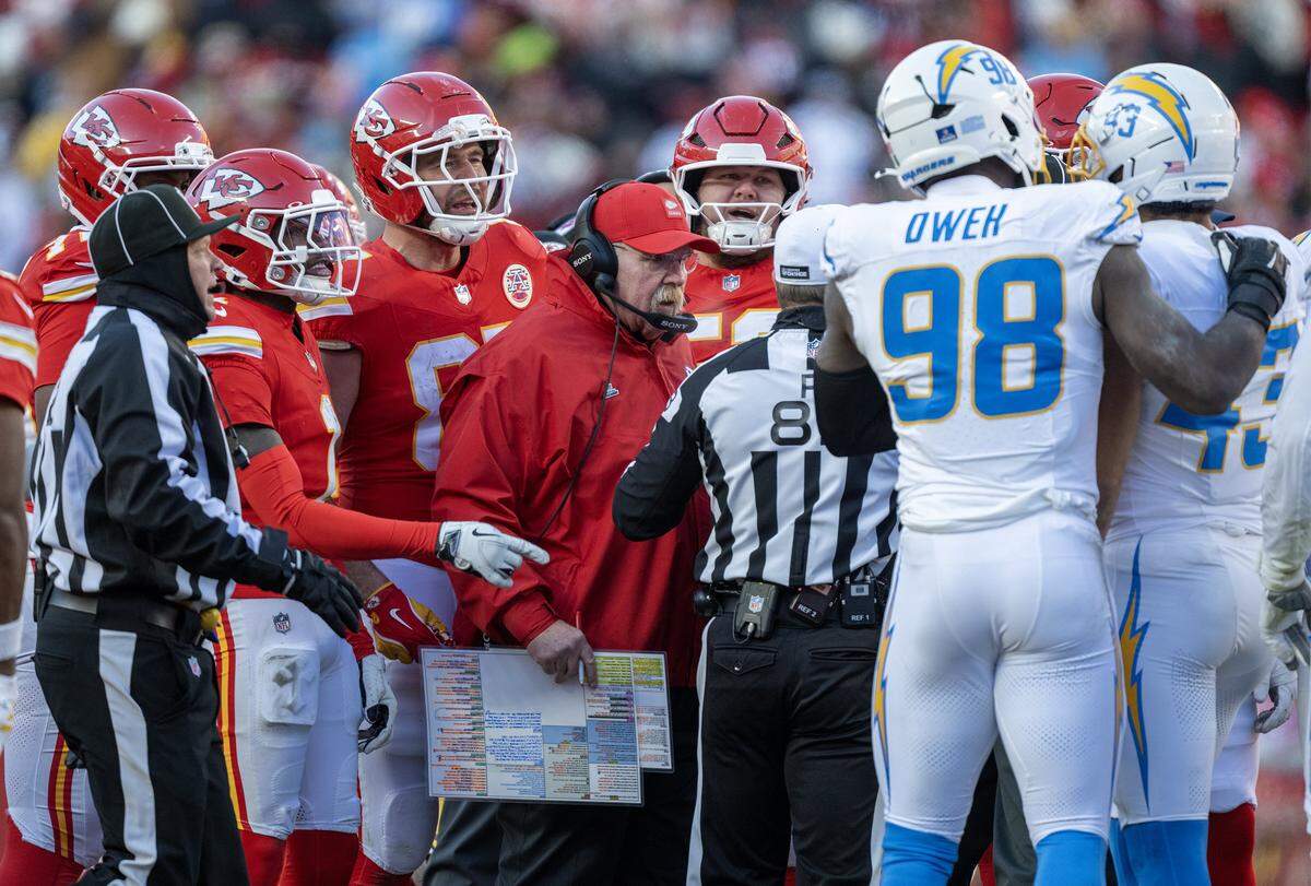 Chiefs Head Coach Andy Reid, tight end Travis Kelce and others got into it with the Chargers at midfield after Los Angeles Chargers' Tony Jefferson (23) laid a hit to Kansas City Chiefs wide receiver Tyquan Thornton (80) in the second half on Sunday, Dec. 14, 2025 at GEHA Field at Arrowhead Stadium in Kansas City. Jefferson was ejected after the skirmish.