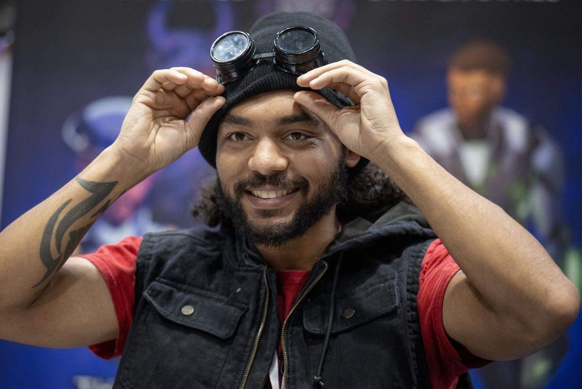 Basi Affia, an Army veteran and a Black comic book creator and publisher in Iowa and Nebraska, owner of Sensiil Studios, runs his booth during Planet Comicon Kansas City on Sunday, March 29, 2026, at Bartle Hall.