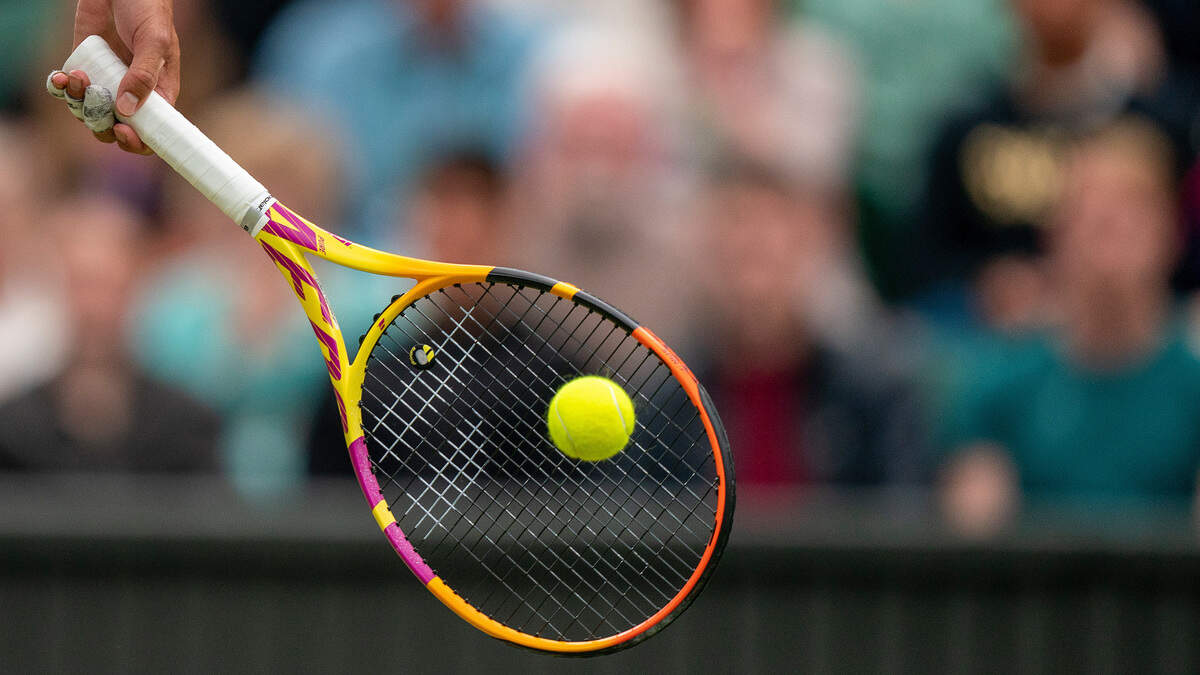 In this 2022 file photo from London, UK, a tennis player prepares to hit the ball during a singles match.