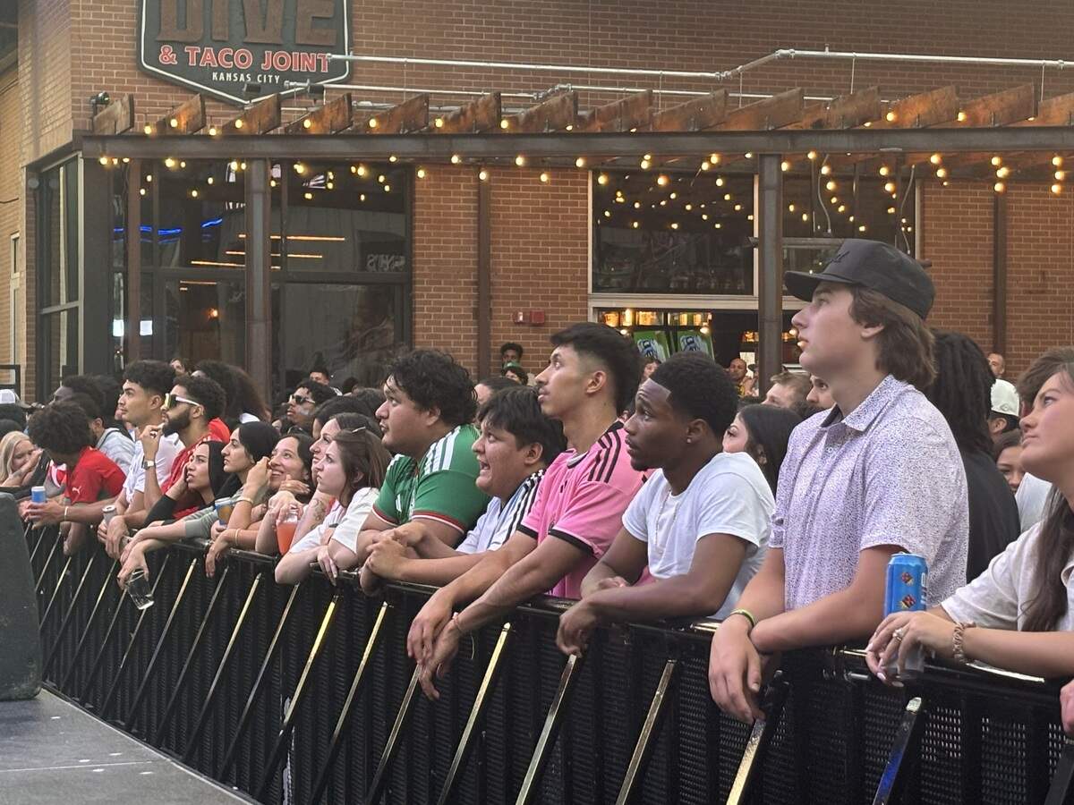 Fans watch from as close as they can get at KC Live for the kick-off of the Algeria and Argentina game in Kansas City.