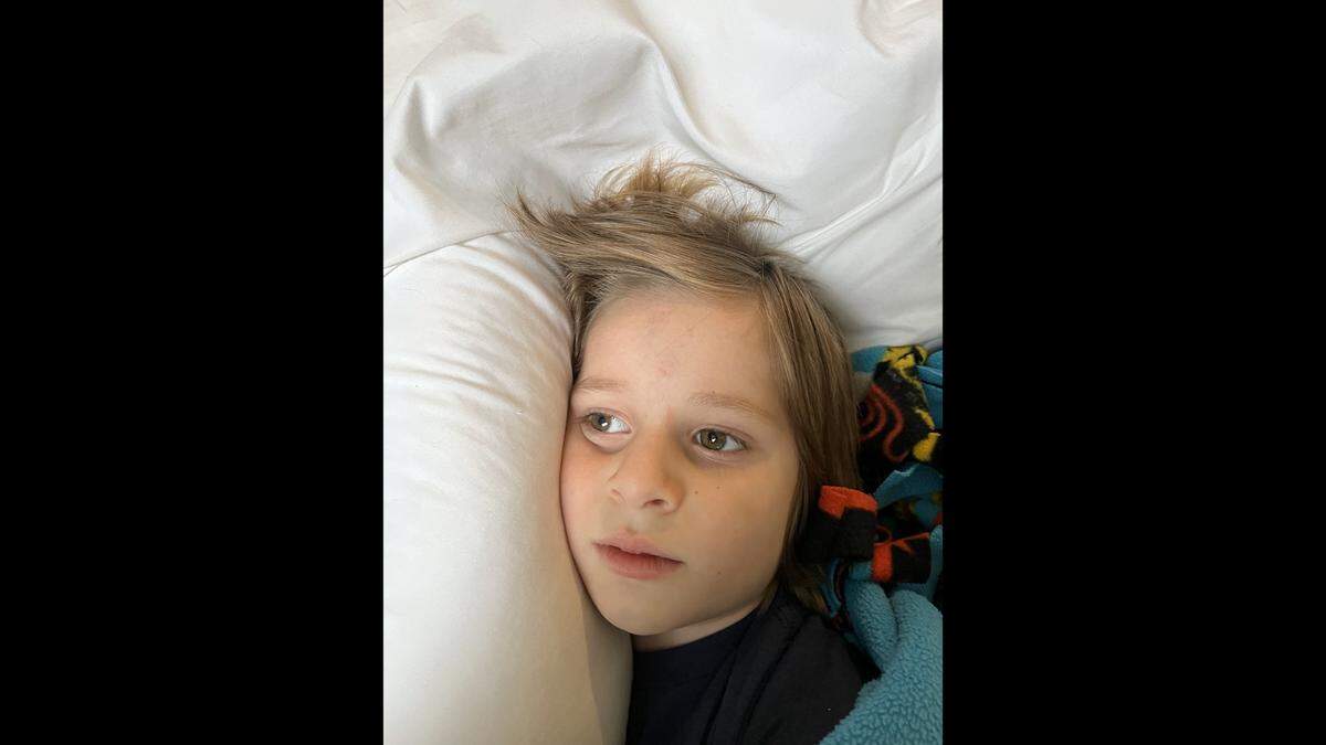 Grayson O’Connor, 5, is pictured in a photograph taken by neighor Kelsey Grzib, 35, who says she found Grayson abandoned at a bus stop by his mother and took him under her care temporarily. Grayson was found dead in an alley behind the Grand Boulevard Lofts in downtown Kansas City, where he and his mother lived on the 17th floor. Police have said his body fell from an open window.