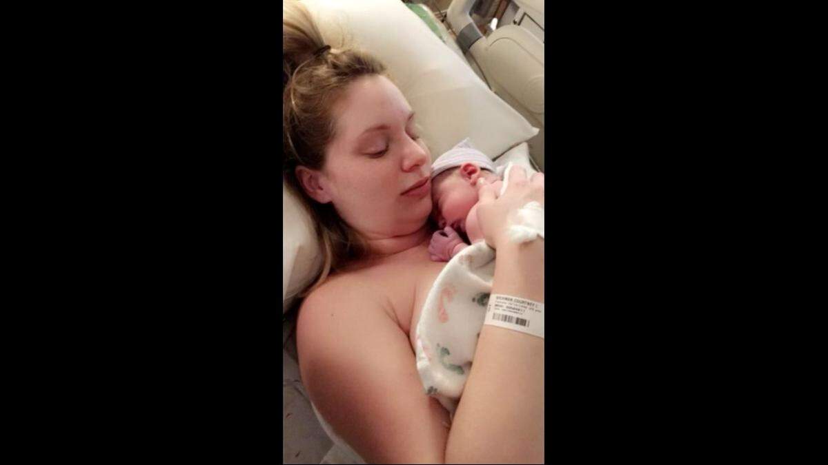 Courtney Wickman holds her daughter Lana, named after singer Lana Del Rey, after she was born.