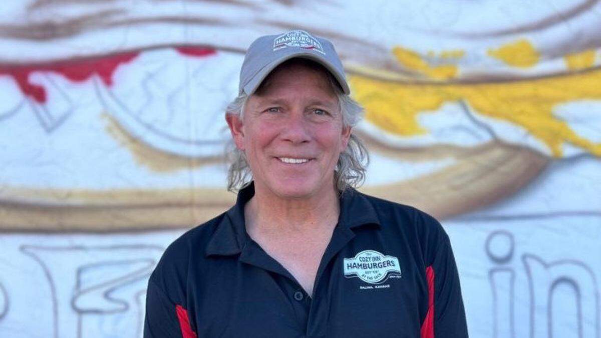 Steve Howard, owner of The Cozy Inn, stands in front of his restaurant located at 108 N. 7th St. in Salina. Howard is in the middle of a legal battle with the city of Salina over the right to paint a mural on his building.