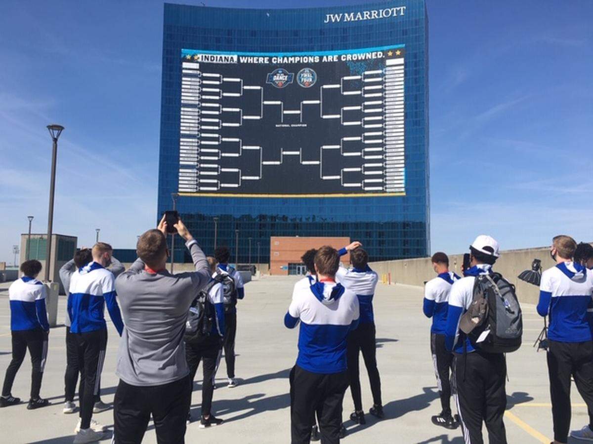 A giant men’s NCAA Tournament bracket is plastered on the outside of the JW Marriott hotel in Indianapolis.