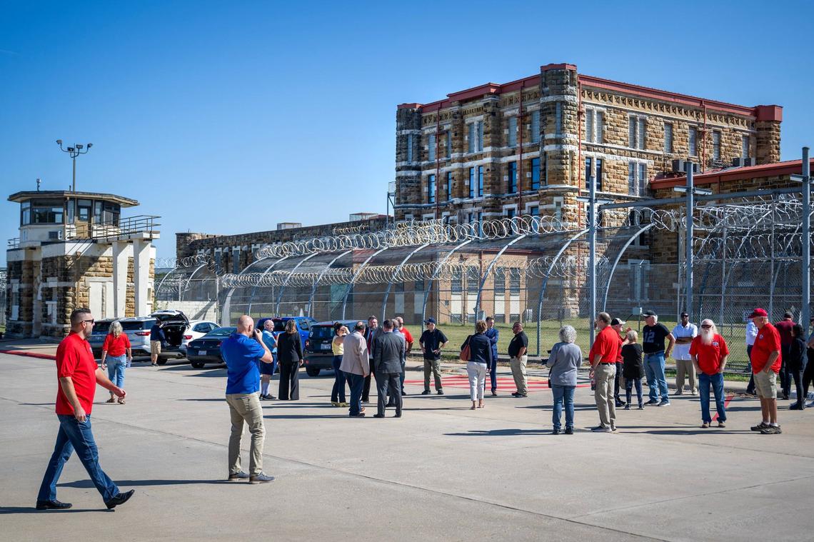 Members of the community, the Lansing Historical Society and Museum and dignitaries gathered outside the Lansing Correctional Facility, which closed in 2020, for the transfer of keys on Monday, Sept. 9, 2024, to the Lansing Historical Society and Museum which will begin offering tours of the prison to the public beginning Friday, Sept. 13, 2024.