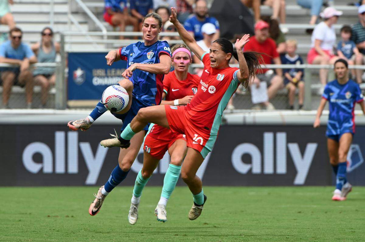 Kansas City Current midfielder Lo’eau LaBonta, right, battles North Carolina Courage forward Haley Hopkins for the ball during Sunday’s NWSL match at WakeMed Soccer Park.