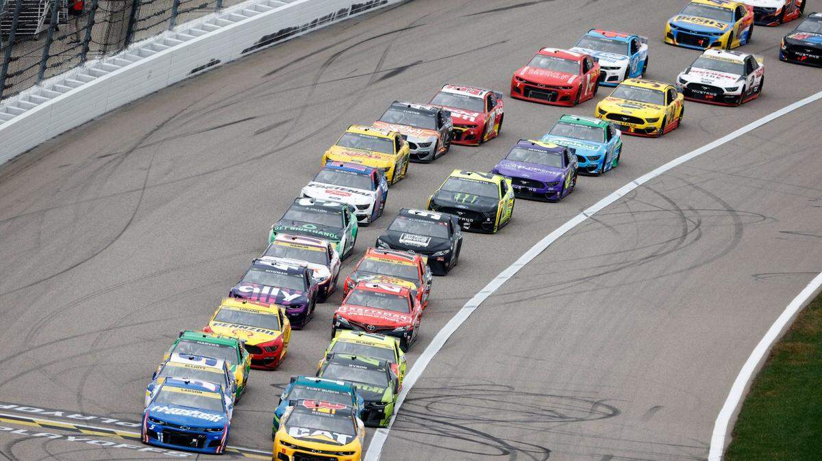 Kyle Larson and Tyler Reddick lead a restart during last year’s Hollywood Casino 400 NASCAR Cup playoff race at Kansas Speedway in Kansas City, Kan.