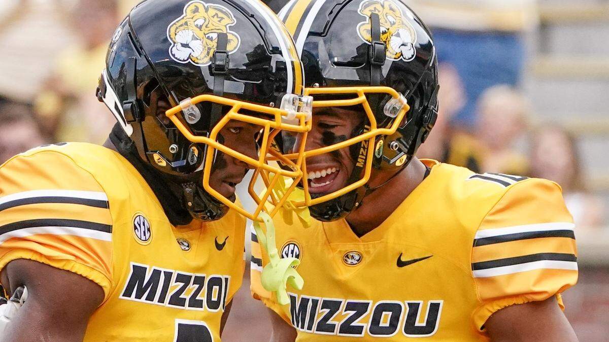 Missouri wide receiver Luther Burden III, left, celebrates an October 2022 touchdown with teammate Mekhi Miller at Faurot Field.