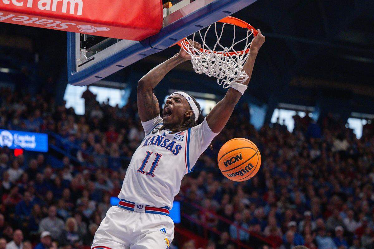 Kansas Jayhawks guard Jamari McDowell (11) dunks the ball in the first half vs. the Utah Utes on Saturday, February 7, 2026, at Allen Fieldhouse.
