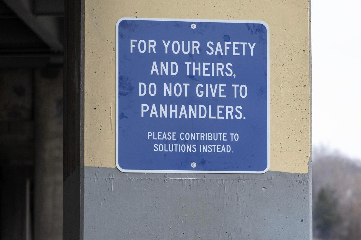 At the I-35 underpass at West Pennway St., a sign whose author is unknown advises people not to give to panhandlers. The Missouri Department of Transportation plans to take the sign down