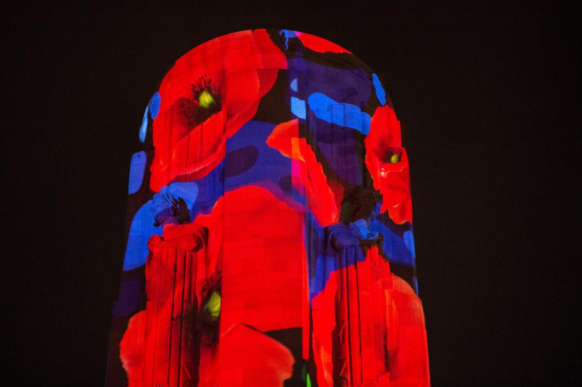The image on the tower is made by several projectors placed around the museum grounds projecting the artwork onto the structure.