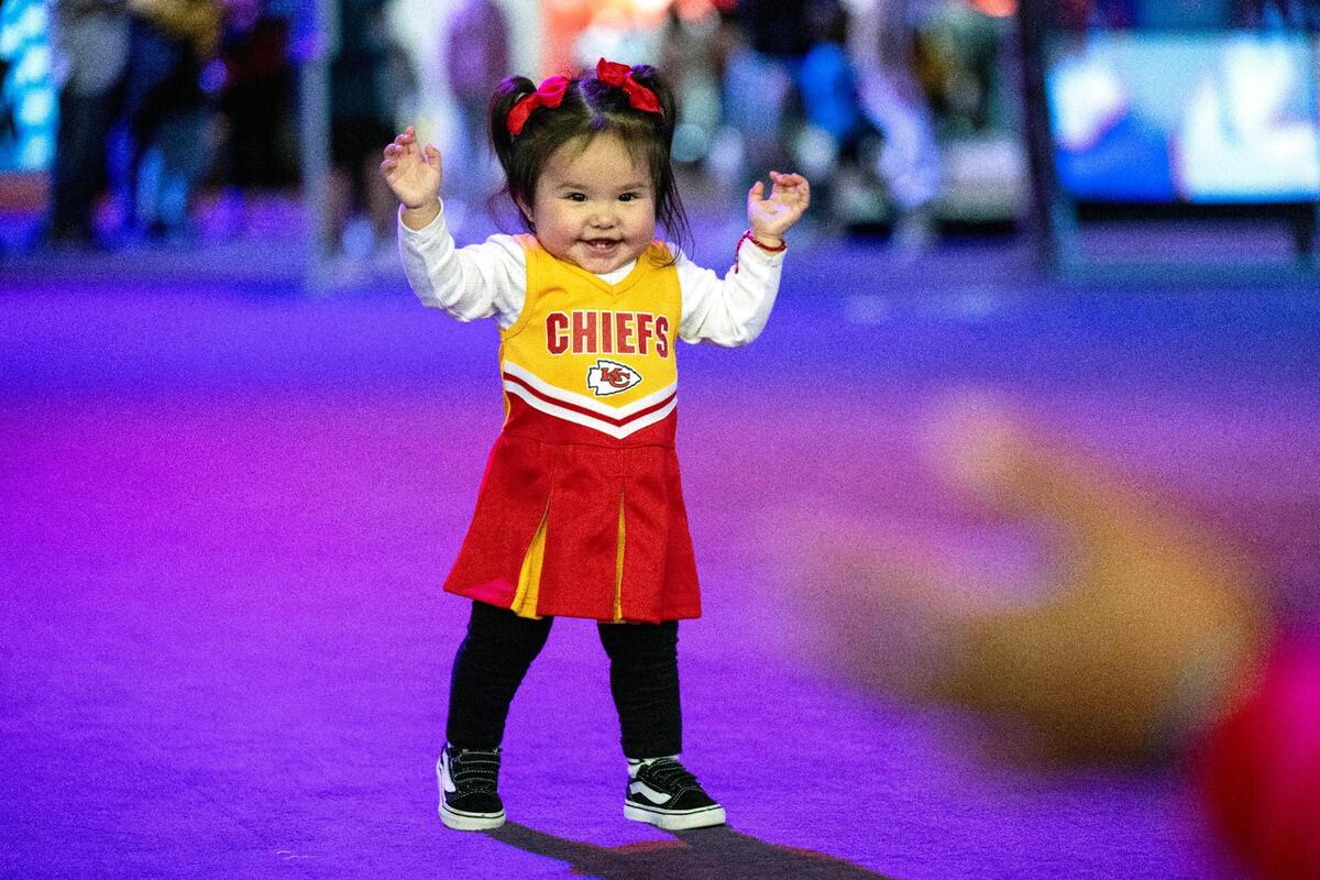 Kansas City Chiefs fans including one-year-old Ayla Hernandez of Pasadena, California, took in the Super Bowl Experience with her parents and grandparents on Thursday, Feb. 8, 2024, in Las Vegas, Nevada.