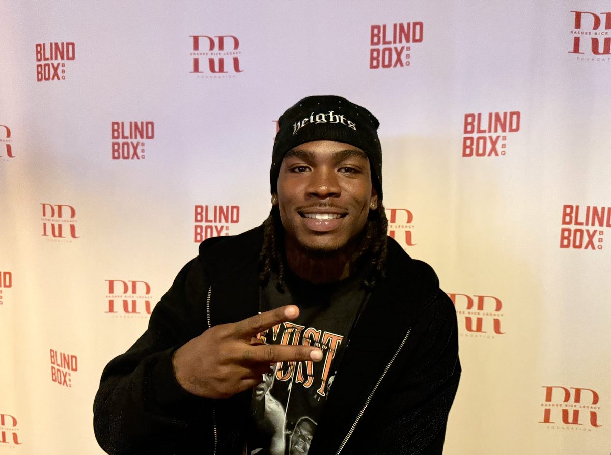Rashee Rice poses before his “Meat and Greet” event at Blind Box BBQ in Shawnee on Thursday, Nov. 6.