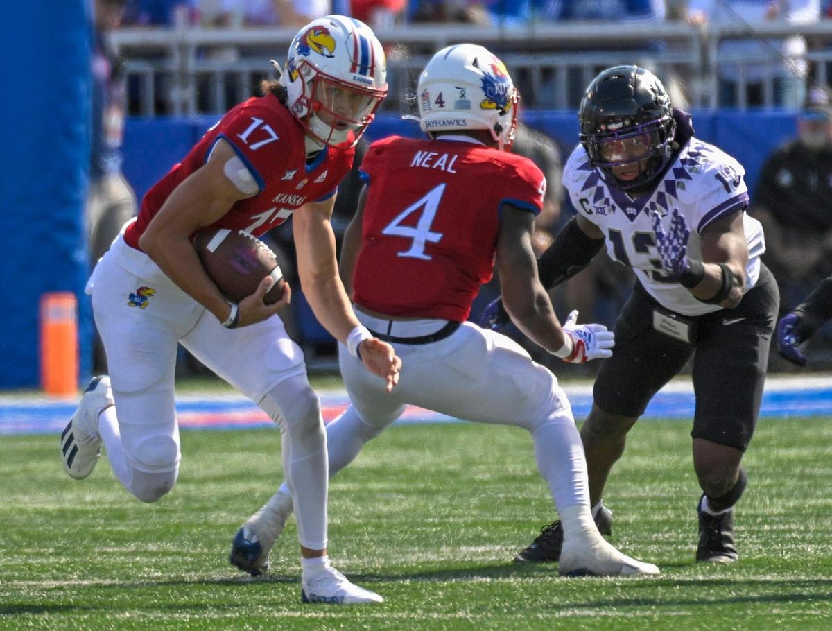 Kansas Jayhawks quarterback Jason Bean (17) scrambled for yardage in the fourth quarter as the tema took on the TCU Horned Frogs at Booth Memorial Stadium on Saturday, Oct. 8, 2022, in Lawrence, Kansas. TCU defeated Kansas, 38-31.