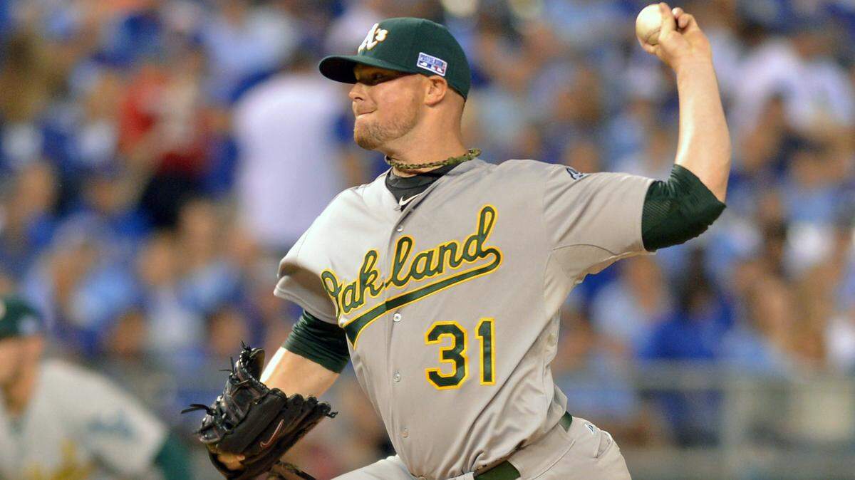 Oakland Athletics starting pitcher Jon Lester (31) throws a pitch against the Kansas City Royals during the first inning of the 2014 American League Wild Card playoff baseball game at Kauffman Stadium.