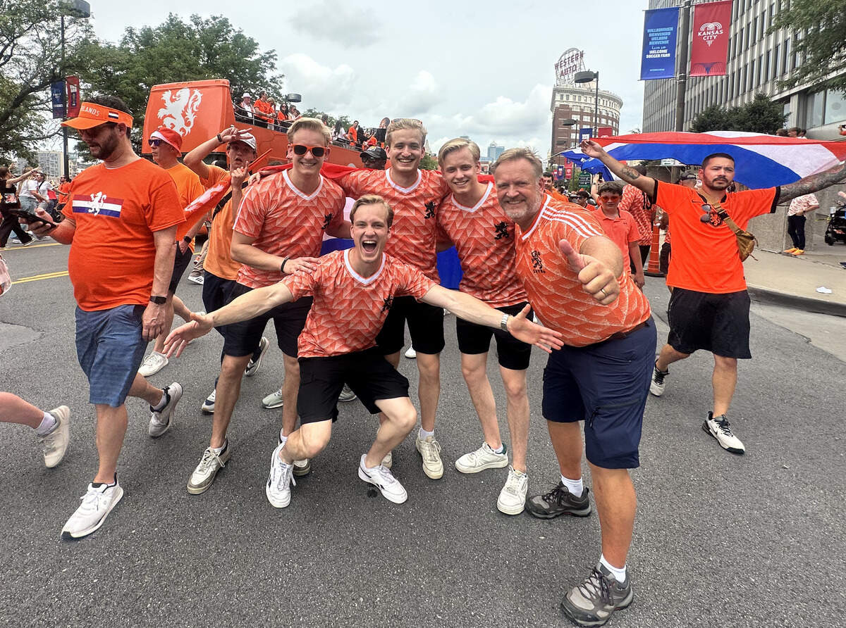 The Van Dougen family pose for a photo in the middle of the Orange Fanwalk. Richard Van Dougen traveled with his four sons to their first World Cup match on Thursday.