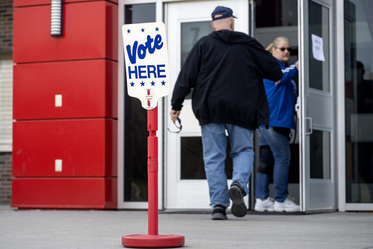 A “Vote Here” sign is displayed in front of the gym doors at Van Horn High School during Election Day on Tuesday, April 7, 2026, in Independence.