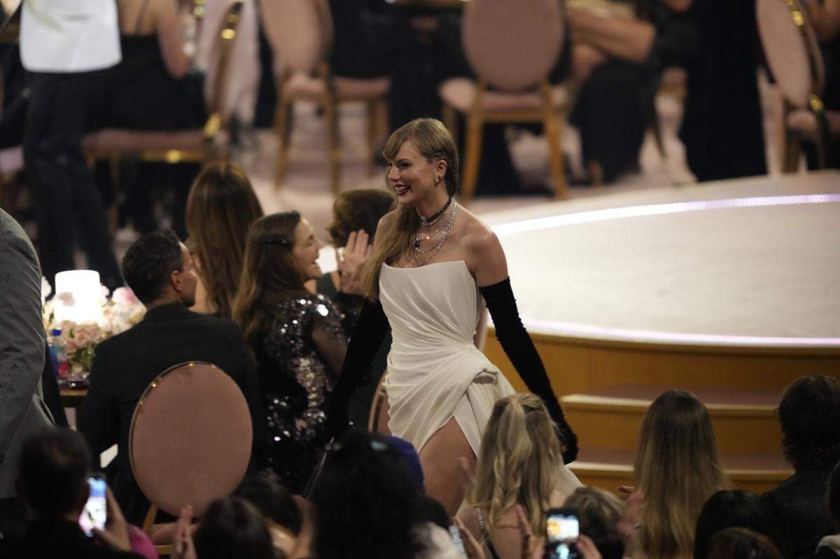 There was no missing Taylor Swift at the Grammy Awards Sunday as her “late arrival” became part of host Trevor Noah’s opening monologue.