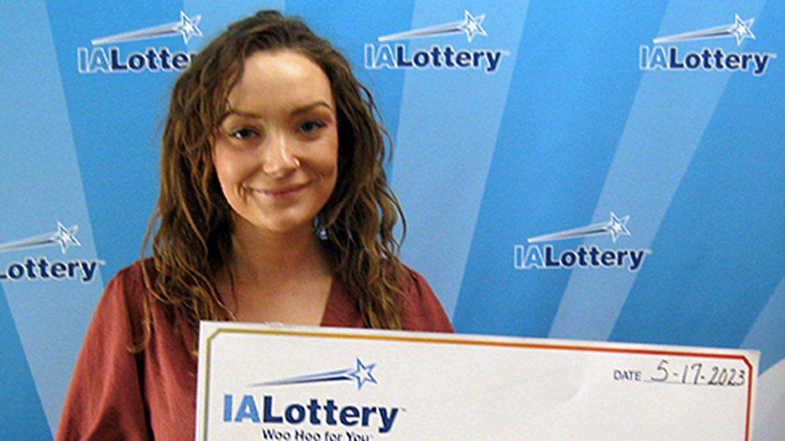 Ivy Wilson with her oversized check.