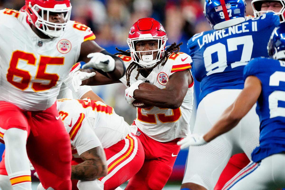 Kansas City Chiefs running back Kareem Hunt, at center of photo, runs with the ball against the New York Giants during an NFL Week 3 game at MetLife Stadium in East Rutherford, New Jersey, on Sunday, Sept. 21, 2025.