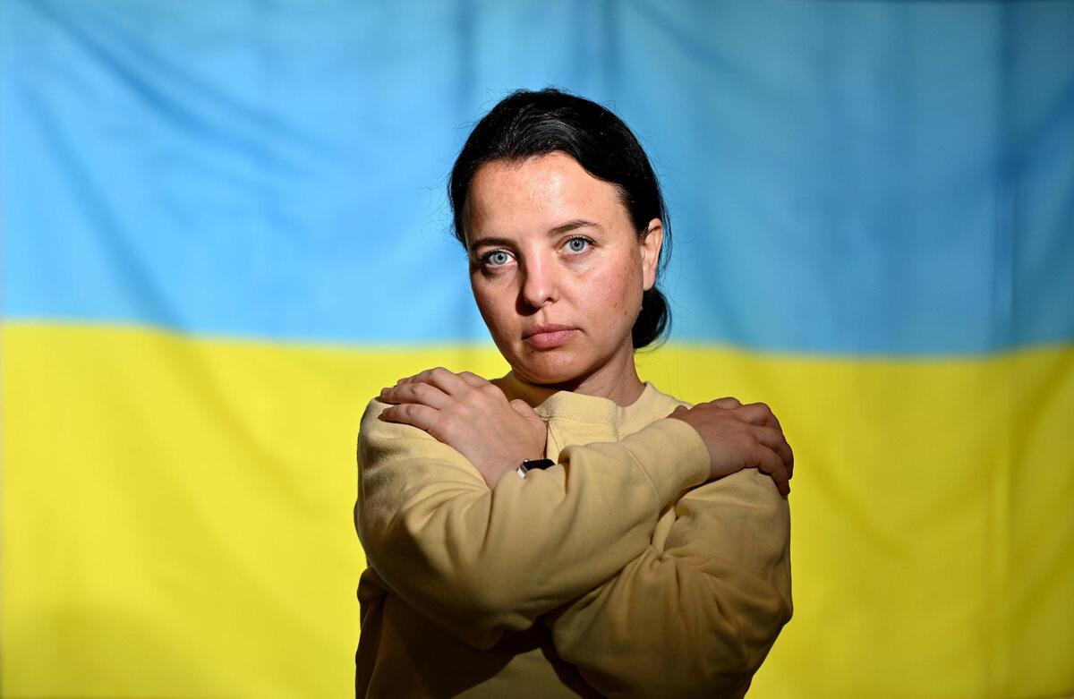Iryna Yeromenko, pictured in front of the Ukrainian flag, fled eastern Ukraine with her family in 2014. Yeromenko, who is Jewish, received help from the Jewish community and Jewish Vocational Services and was able to go back to school, afford legal resources and secure assylum.