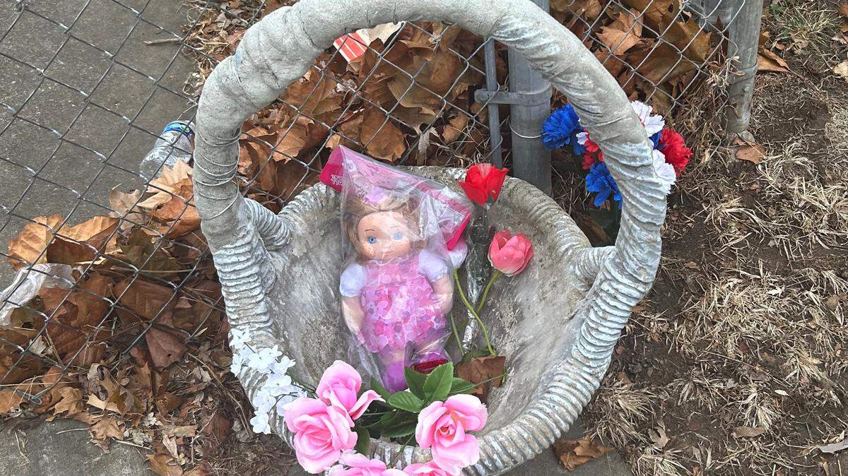 A makeshift memorial was left outside of the apartment on St. John Avenue where a girl nearly 5 years old was found dead due to malnutrition and dehydration.