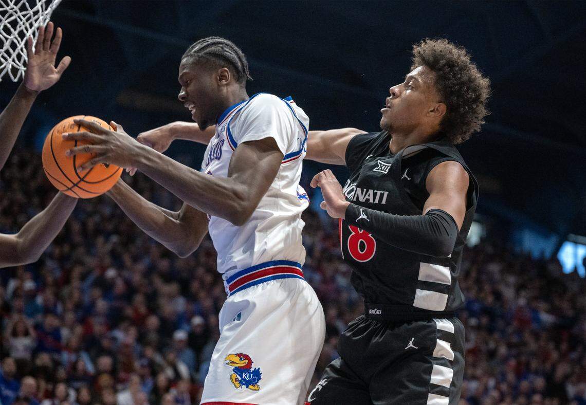 Kansas Jayhawks forward Flory Bidunga (40) goes up for a rebound as Cincinnati Bearcats forward Baba Miller (18) defends in the first half Allen Fieldhouse on Saturday, Feb. 21, 2026, in Lawrence, Kansas.