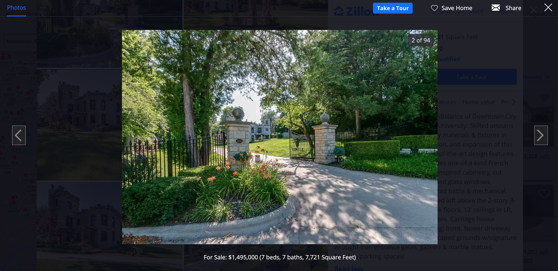The property features a wrought-iron gate.
