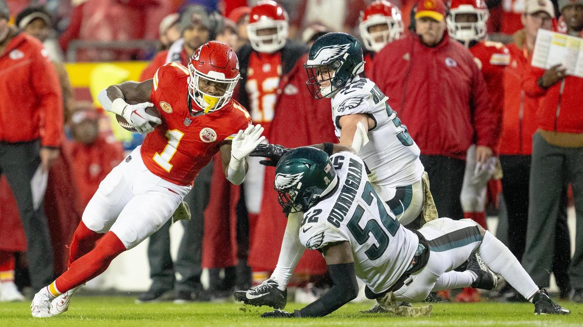 Kansas City Chiefs running back Jerick McKinnon (1) runs around Philadelphia Eagles linebacker Zach Cunningham (52) during an NFL football game on Monday, Nov. 20, 2023, at GEHA Field at Arrowhead Stadium in Kansas City.