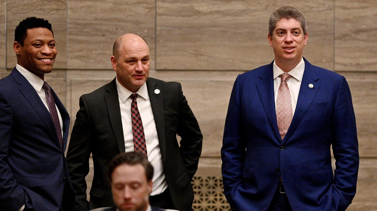 Sen. Bill Eigel, R-Weldon Spring, from right, Sen. Denny Hoskins, R-Warrensburg, and Sen. Brian Williams, D-University City, chat during the afternoon session as Missouri senators convene at the state capitol in Jefferson City Wednesday, Feb. 23, 2022.