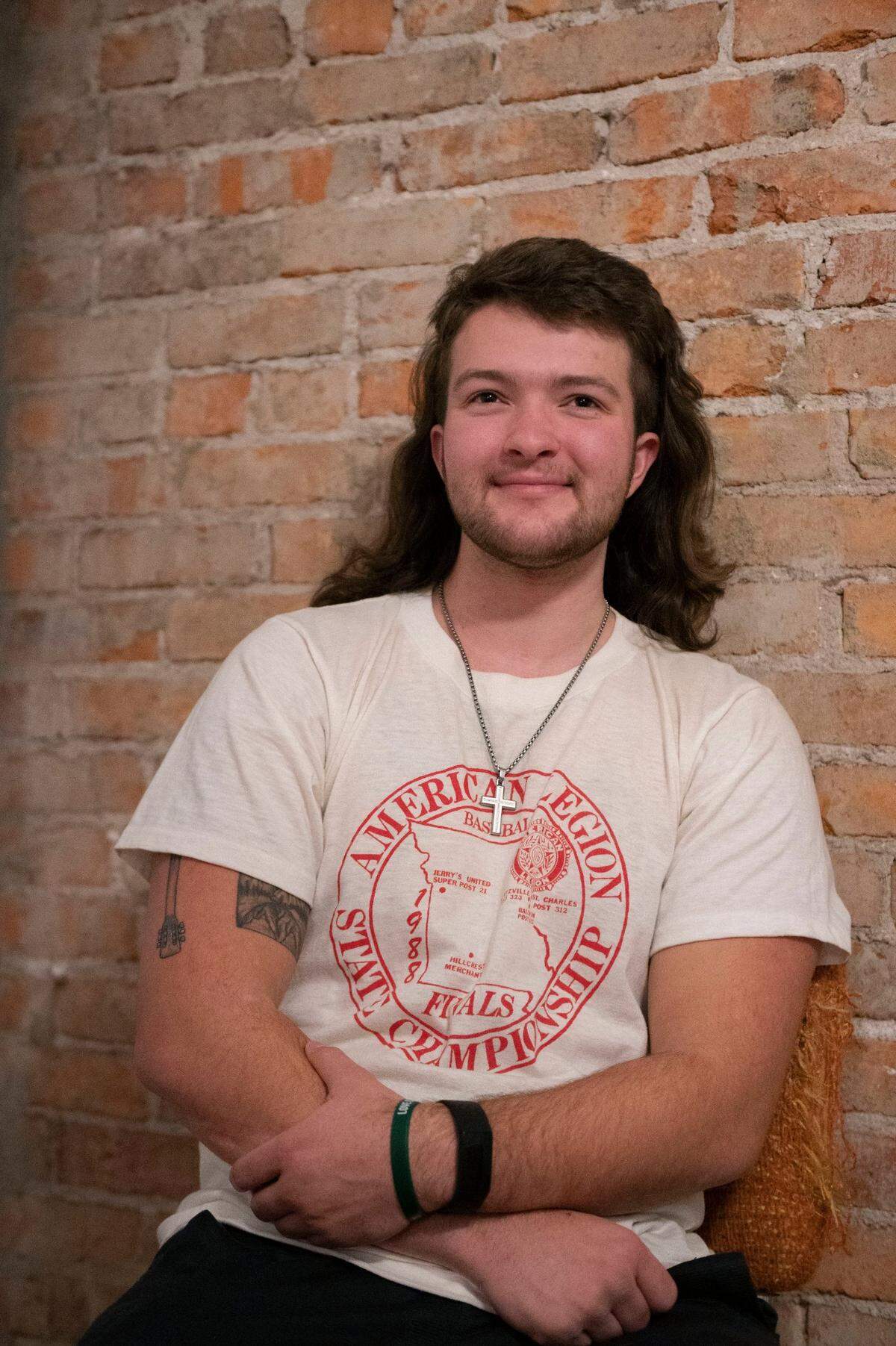 RJ Appleberry smiles during a conversation he has with his girlfriend at their home in Kansas City on Thursday, Jan. 13, 2022.