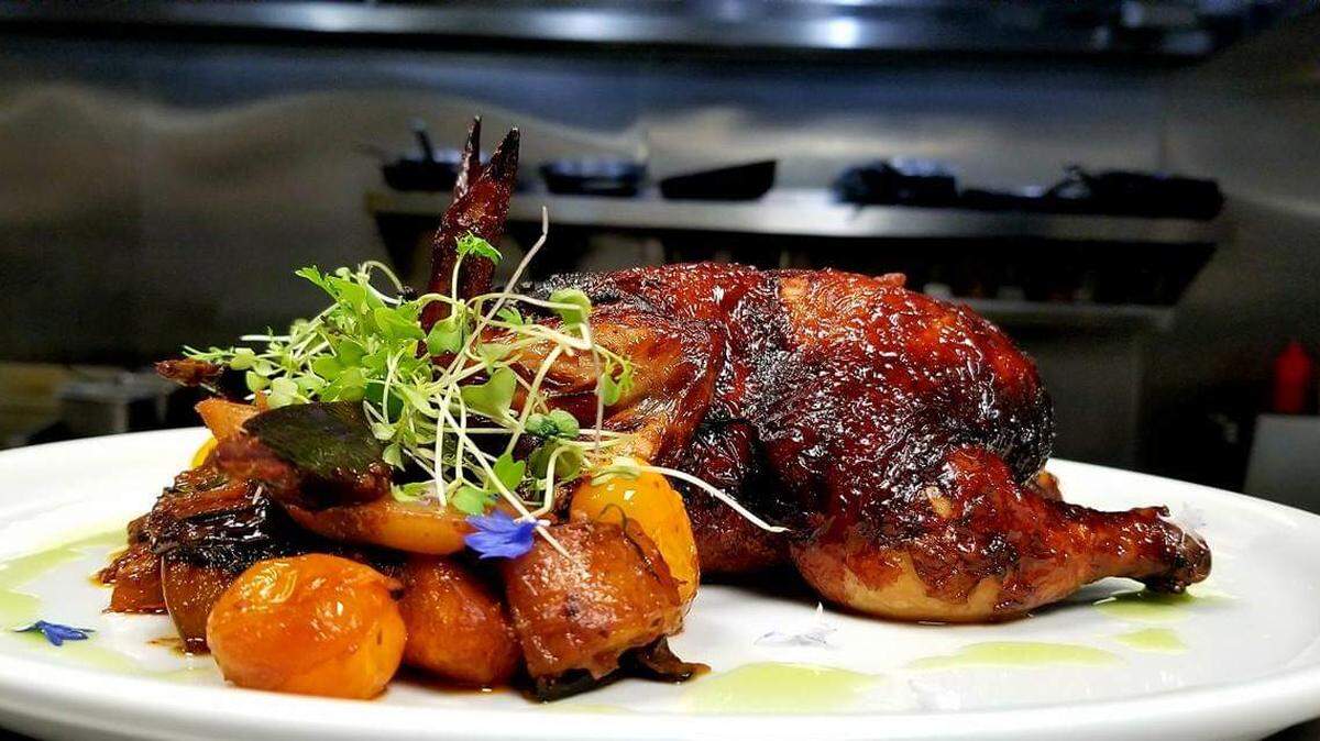 Mesob’s Broadway Chicken with brined Cornish Hens, potatoes, fennel, carrots, asparagus and lemon sauce.