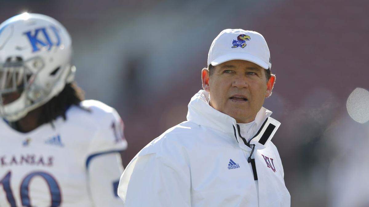 Kansas head coach Les Miles watches warm ups before an NCAA college football game against Iowa State, Saturday, Nov. 23, 2019, in Ames, Iowa. (AP Photo/Matthew Putney)
