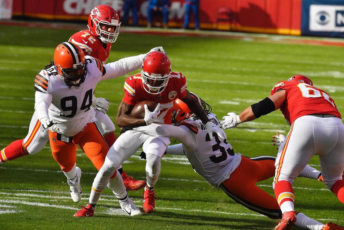 Kansas City Chiefs wide receiver Mecole Hardman is taken down by Cleveland Browns safety Jovante Moffatt in the first half Sunday, January 17, 2021, at Arrowhead Stadium in Kansas City, Missouri.