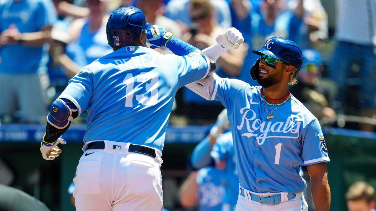 Royals catcher Salvador Perez (No. 13) high-fives right fielder MJ Melendez after hitting a first-inning homer against the Oakland Athletics on Sunday afternoon at Kauffman Stadium.