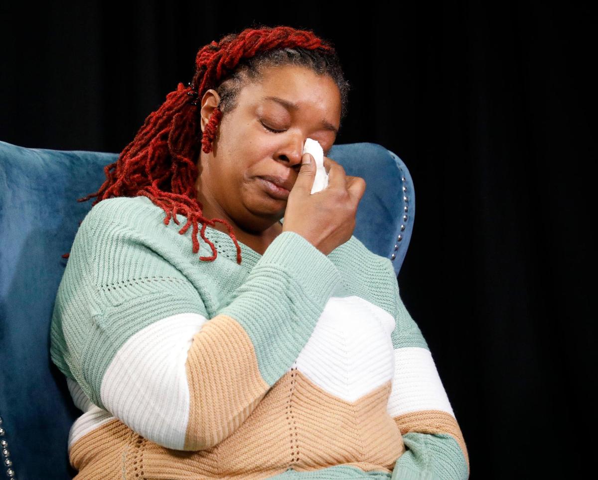 Shawntel Anderson wipes away what she called “tears of joy” in Dallas on Saturday. She met with the men who found her on a back porch in Kansas City in 1982.