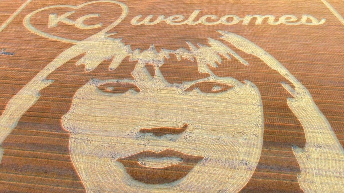 Cutting a swath through the wheat stubble, Rob Stouffer of Precision Mazes, worked Monday, July 3, 2023, creating a mammoth welcome message to Taylor Swift in a field in Orrick, Missouri, in Ray County. It took Stouffer about 13 hours to create the crop art.