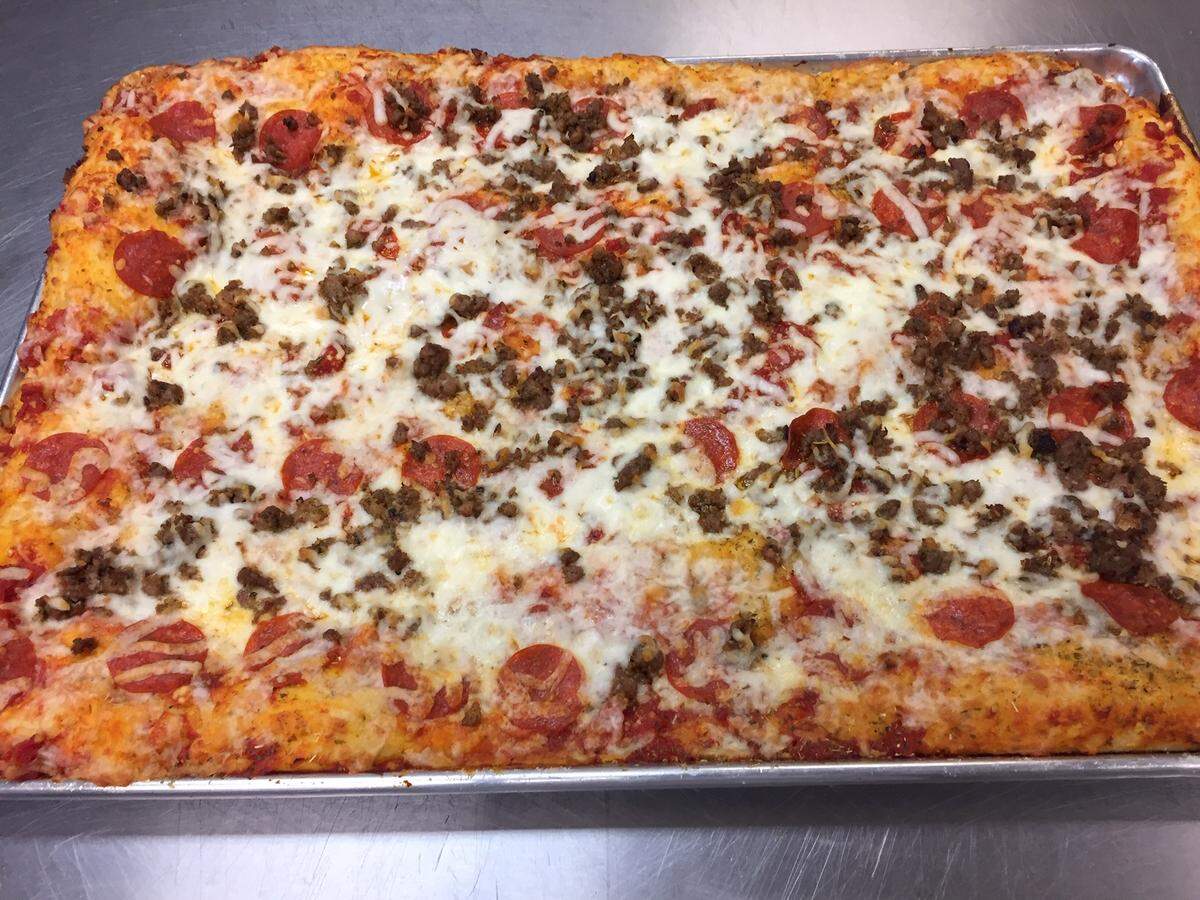 Italian Gardens Pizza offers six different Sicilian-style pizzas including Italian sausage and pepperoni.