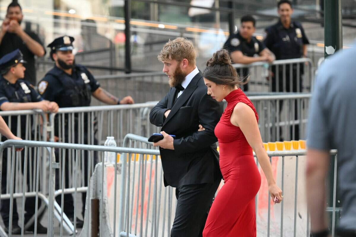 People arrive outside Madison Square Garden, the reported venue for the wedding celebrations of pop singer Taylor Swift and pro-athlete Travis Kelce, in New York City on July 3, 2026. Swift and Kelce's official wedding plans are tightly under wraps, but New York is bracing to host the celebrity marriage of the year this week at Madison Square Garden. The wedding will reportedly take place Friday with a star-studded guest list of around 1,000, including models Gigi Hadid and Cara Delevingne, singer Selena Gomez, and actress Zoe Kravitz -- all known to be close Swift pals -- and Kelce's Kansas City Chiefs teammates. (Photo by ANGELA WEISS / AFP via Getty Images)